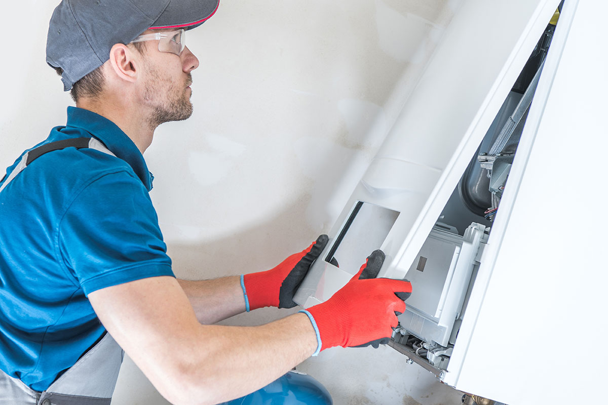 Technician installing furnace